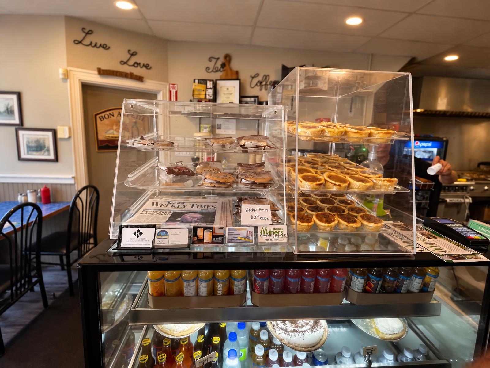 Bakery display case with butter tarts and desserts