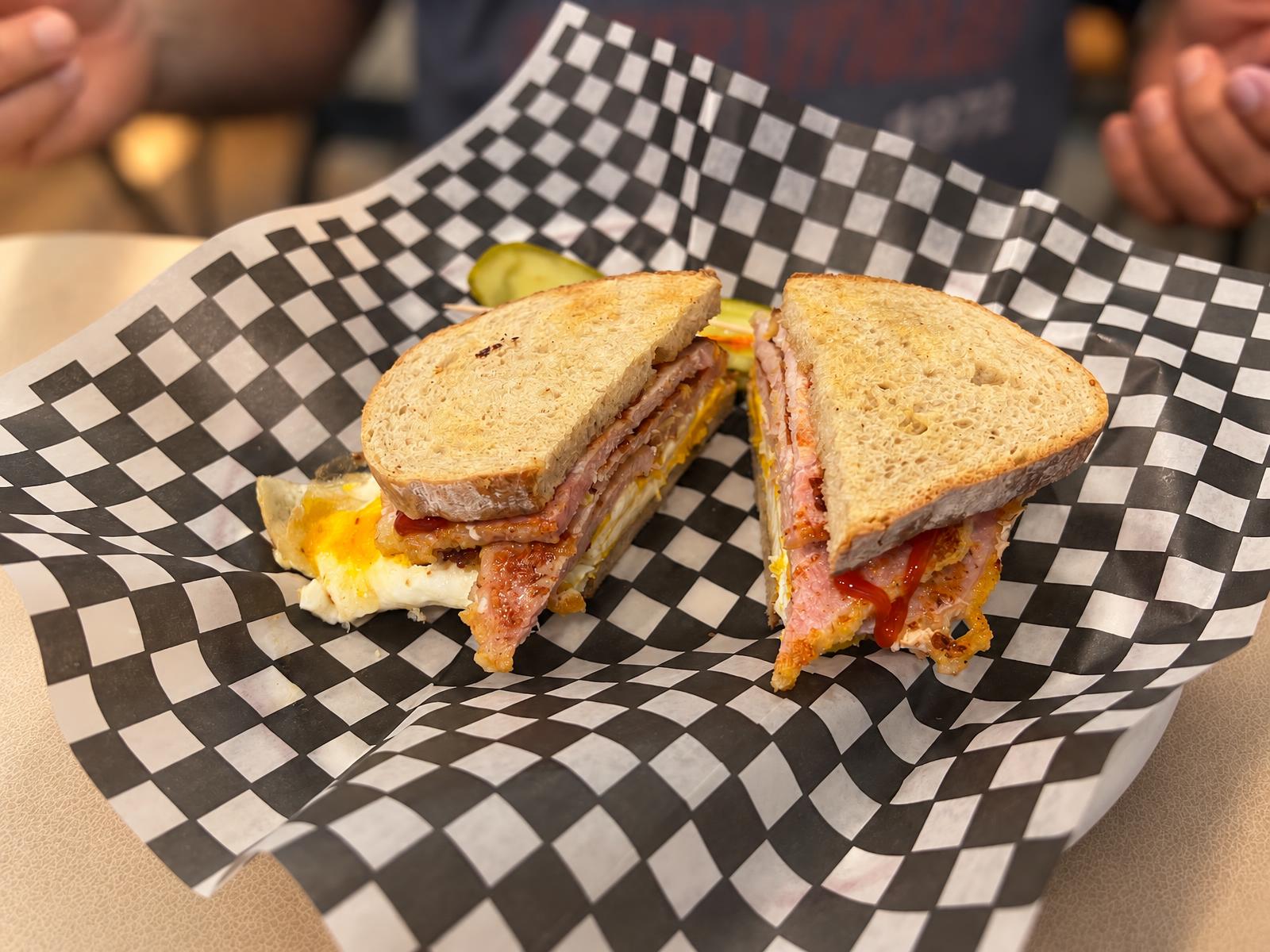 Grilled breakfast sandwich with egg and ham